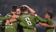 Juventus’ Sami Khedira celebrates scoring their first goal with Gonzalo Higuain and teammates REUTERS/Alberto Lingria	
