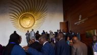 Delegates leave the plenary hall of the Africa Union (AU) headquarters, before the start of the 30th Ordinary Session of the Assembly of Heads of State and Government of the AU in Addis Ababa on January 27, 2018. / AFP / SIMON MAINA