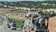 A military convoy carries Turkish-backed Syrian rebel fighter and rebels's vehicles as they are dispatched to the border in Kilis, near the Turkish-Syrian border on January 29, 2018, as part ot the operation 