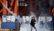 A protesters is seen as they clash with Israeli security forces during a protest against US decision to suspend financial aid earmarked for the UN Relief and Works Agency (UNRWA), at Jalazone refugee camp in Ramallah, West Bank on January 28, 2018. (Issam