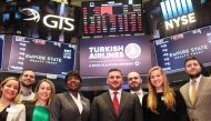 Cenk Ocal, General Manager of the Turkish Airlines, New York (front 3rd R) poses for a family photo with his team mates after Turkish Airlines rang the opening bell of New York Stock Exchange , in New York, United States on January 30, 2018. At?lgan Özdil