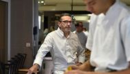 (FILES) This file photo taken on September 21, 2017, shows French chef Sebastien Bras posing in the kitchen of his three-star restaurant Le Suquet, in Laguiole, southern France, after announcing that he asked not to be included in the Michelin Guide start
