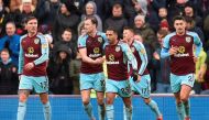 Burnley players celebrate after Burnley's Icelandic midfielder Johann Berg Gudmundsson scored their first goal to equalise 1-1 during the English Premier League football match between Burnley and Manchester City at Turf Moor in Burnley, north west England