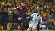 Real Madrid’s Dani Carvajal in action with Levante's Jose Morales as Real Madrid coach Zinedine Zidane looks on REUTERS/Heino Kalis