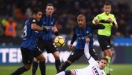 Inter Milan's forward Rafinha Alcantara of Brazil (C) fights for the ball with Crotone's forward Adrian Stoian from Romania (R) during the Italian Serie A football match Inter Milan Vs Crotone on February 3, 2018 at 'Giuseppe Meazza' stadium in Milan. / A