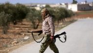 Turkey-backed Free Syrian Army fighter is seen at al Ajami village in east al Bab, Syria February 3,2018.REUTERS/ Khalil Ashawi