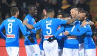 Napoli's Slovakian midfielder Marek Hamsik (2ndR) celebrates with teammates after scoring a goal during the Italian Serie A football match SSC Napoli vs Benevento Calcio at Ciro Vigorito Stadium on February 4, 2018. / AFP / CARLO HERMANN
 