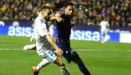 Real Madrid's defender Dani Carvajal (L) vies with Levante's forward Ivan Lopez 