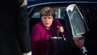 German Chancellor Angela Merkel, leader of the conservative Christian Democratic Union (CDU), gets off her car as she arrives for further talks to form a new government in Berlin on February 6, 2018. AFP / Gregor Fischer