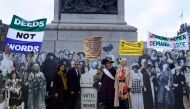  (L-R) Activist Amika George, The Mayor of London Sadiq Khan, historian Lucy Worsley and deputy mayor for culture and creativity Justine Simons pose in Trafalgar square against a backdrop of lifesize pictures of members of the Suffragete movement to mark 