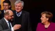(FILES) This file photo taken on February 02, 2018 in Berlin shows German Chancellor and leader of the Christian Democratic Union (CDU) Angela merkel (R), the leader of the Social Democratic Party (SPD) Martin Schulz (L) and the chairman of the Bavarian C