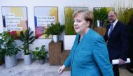 Christian Democratic Union (CDU) leader and German Chancellor Angela Merkel and Social Democratic Party (SPD) leader Martin Schulz arrive for a statement on coalition talks to form a new coalition government in Berlin, Germany, February 7, 2018. REUTERS/H
