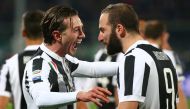 Juventus’ Federico Bernardeschi celebrates with Gonzalo Higuain after scoring their first goal REUTERS/Alessandro Bianchi
