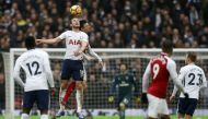 Tottenham Hotspur's English striker Harry Kane (2L) leaps for the ball against Arsenal's French defender Laurent Koscielny (3L) during the English Premier League football match between Tottenham Hotspur and Arsenal at Wembley Stadium in London, on Februar