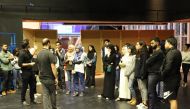  NU-Q students listen to Tom Casserly and George Bajalia at the start of the Creative Media Festival.