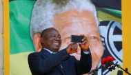 South African Deputy-President Cyril Ramaphosa use his phone during a rally to commemorate Nelson Mandela's centenary year in Cape Town, South Africa, February 11, 2018. Reuters/Mike Hutchings