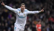 Real Madrid's Portuguese forward Cristiano Ronaldo celebrates after scoring during the Spanish league football match between Real Madrid CF and Real Sociedad at the Santiago Bernabeu stadium in Madrid on February 10, 2018. / AFP / GABRIEL BOUYS
