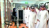 QU President Dr Hassan Al Derham and other officials touring the gymnasium. 