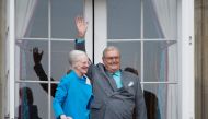 This file photo taken on April 16, 2016 shows Danish Queen Margrethe and Prince Henrik greeting well-wishers from the balcony on the occasion of the Queen's 76th Birthday celebration at Amalienborg Palace in Copenhagen. Denmark OUT / AFP / Scanpix Denmark
