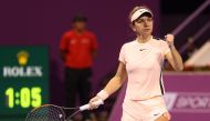 Romanian tennis player Simona Halep reacts after playing a point against Russian player Ekaterina Makarova as they compete in their singles match during the second round of the Qatar Open tennis competition in Doha on February 14, 2018. / AFP / KARIM JAAF