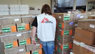 In this file photo taken on January 13 2010 a member of French association Doctors without borders is seen at the association logistics hub in Bordeaux-Merignac, as the association was getting ready to provide medicines in Haiti, following a huge earthqua