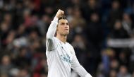 Real Madrid's Portuguese forward Cristiano Ronaldo celebrates at the end of the UEFA Champions League round of sixteen first leg football match Real Madrid CF against Paris Saint-Germain (PSG) at the Santiago Bernabeu stadium in Madrid on February 14, 201