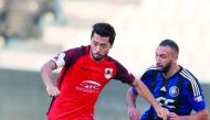 Al Rayyan’s Rodrigo Tabata (left) is challenged by a Al Sailiya player during the QNB Stars League match in Doha yesterday.