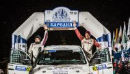 Qatar’s Adel Abdulla and navigator Nasser Al Kuwari wave to the crowd during the opening round of the 2018 FIA World Cup for Cross-Country Rallies in Karelia, Russia, yesterday.