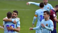 Barcelona's Uruguayan forward Luis Suarez (2L) congratulates Barcelona's Spanish defender Jordi Alba (L) for his goal while Barcelona's Brazilian midfielder Philippe Coutinho (R) approaches during the Spanish league football match between SD Eibar and FC 