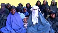 (FILES) This file handout video grab released by Islamist militants group Boko Haram on January 15, 2018 shows at least 14 of the schoolgirls abducted from the northeast Nigerian town of Chibok in April 2014.  AFP PHOTO 