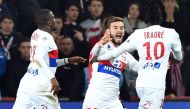 Lyon's Burkinabe forward Bertrand Traore (R) celebrates with teammates after scoring a goal during the French L1 football match between Lille OSC (LOSC) and Lyon at the Pierre-Mauroy Stadium in Villeneuve d'Ascq, near Lille, northern France, on February 1