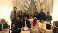 This handout picture released by Pakistan Tehreek-i-Insaaf (PTI) on February 19, 2018, shows Pakistani cricketer-turned-opposition leader and head of the Pakistan Tehreek-i-Insaaf (PTI) party Imran Khan (C) posing for a photograph with his new wife Bushra
