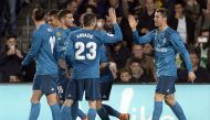 Real Madrid's French forward Real Madrid's Portuguese forward Cristiano Ronaldo (R) celebrates scoring a goal with teammates during the Spanish league football match Real Betis vs Real Madrid at the Benito Villamarin stadium in Sevilla on February 18, 201