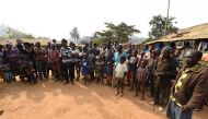 (FILES) This file photo taken on January 31, 2018, shows Cameroonian refugees, including women and children gathering for a meeting at Bashu-Okpambe village in Boki district of Cross Rivers State in Nigeria. AFP / PIUS UTOMI EKPEI