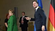 :German Chancellor Angela Merkel and Dutch Prime Minister Mark Rutte leave after a press statement on February 19, 2018 in Berlin. Germany OUT / AFP / dpa / Maurizio Gambarini
