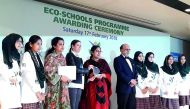 The students and staff of PISQ with the CEO of Doha Bank, Dr. R Seetharaman, after receiving the ECO-Star Trophy. 