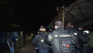 This handout photo released by the French Gendarmerie Nationale shows an operation by French gendarmes to evacuate opponents of a nuclear waste burial site in the Lejuc woods in Bure early on February 22, 2018. AFP PHOTO / GENDARMERIE NATIONALE 