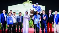Jockey Theo Bachelot celebrates with Reda trainer Julian Smart and team members after winning Al Zubara Trophy. 