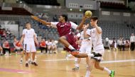 A Qatari player successfully shoots to score a goal against Poland in the Group A boys match of the 24th ISF World Schools Handball Championships at the Ali bin Hamad Al Attiyah Stadium in Al Sadd yesterday.