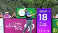 Oliver Fisher of England plays a shot during the third round of the Qatar Masters golf tournament at the Doha Golf Club in Doha, yesterday.