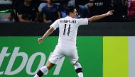 Al Sadd’s Bhagdad Bounedjah celebrates after scoring a goal.