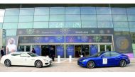 Maserati cars waiting outside the exhibition venue.