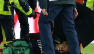 Paris Saint-Germain’s Neymar receives treatment from medical staff after sustaining an injury REUTERS/Stephane Mahe
