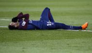 Paris Saint-Germain's Brazilian forward Neymar Jr reacts lying on the pitch during the French L1 football match between Paris Saint-Germain (PSG) and Marseille (OM) at the Parc des Princes in Paris on February 25, 2018. / AFP / GEOFFROY VAN DER HASSELT