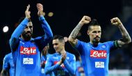 Napoli's Spanish defender Raul Albiol (L) and Napoli's Slovakian midfielder Marek Hamsik celebrates at the end of the Italian Serie A football match Cagliari vs Napoli on February 26, 2018 at Sardinia stadium in Cagliari. / AFP / ALBERTO PIZZOLI