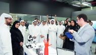H E Sheikh Abdullah bin Saoud Al Thani (third left), Governor of Qatar Central Bank and Chairman of QDB; along with Abdulaziz bin Nasser Al Khalifa (fifth left) QDB CEO and QBIC Chairman and other officials being briefed about QBIC’s ‘Fab Lab’ facilities,