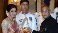 This file photo taken on April 5, 2013 shows then-Indian President Pranab Mukherjee (R) presenting the Padma Shree award to Indian film actress Sridevi (L) during the presentation of the 