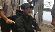 Brazilian superstar Neymar arrives at Rio de Janeiro after flying from Paris on March 1, 2018 ahead of an operation on his fractured foot.  AFP / Claire Dornald Clauzel 
