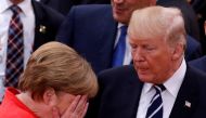 File photo: German Chancellor Angela Merkel reacts next to US President Donald Trump during the G20 leaders summit in Hamburg, Germany July 7, 2017. REUTERS/Philippe Wojazer/File Photo