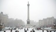 Visitors walk in the snow in Trafalgar Square, in central London, Britain March 2, 2018. REUTERS/Andrew Winning
